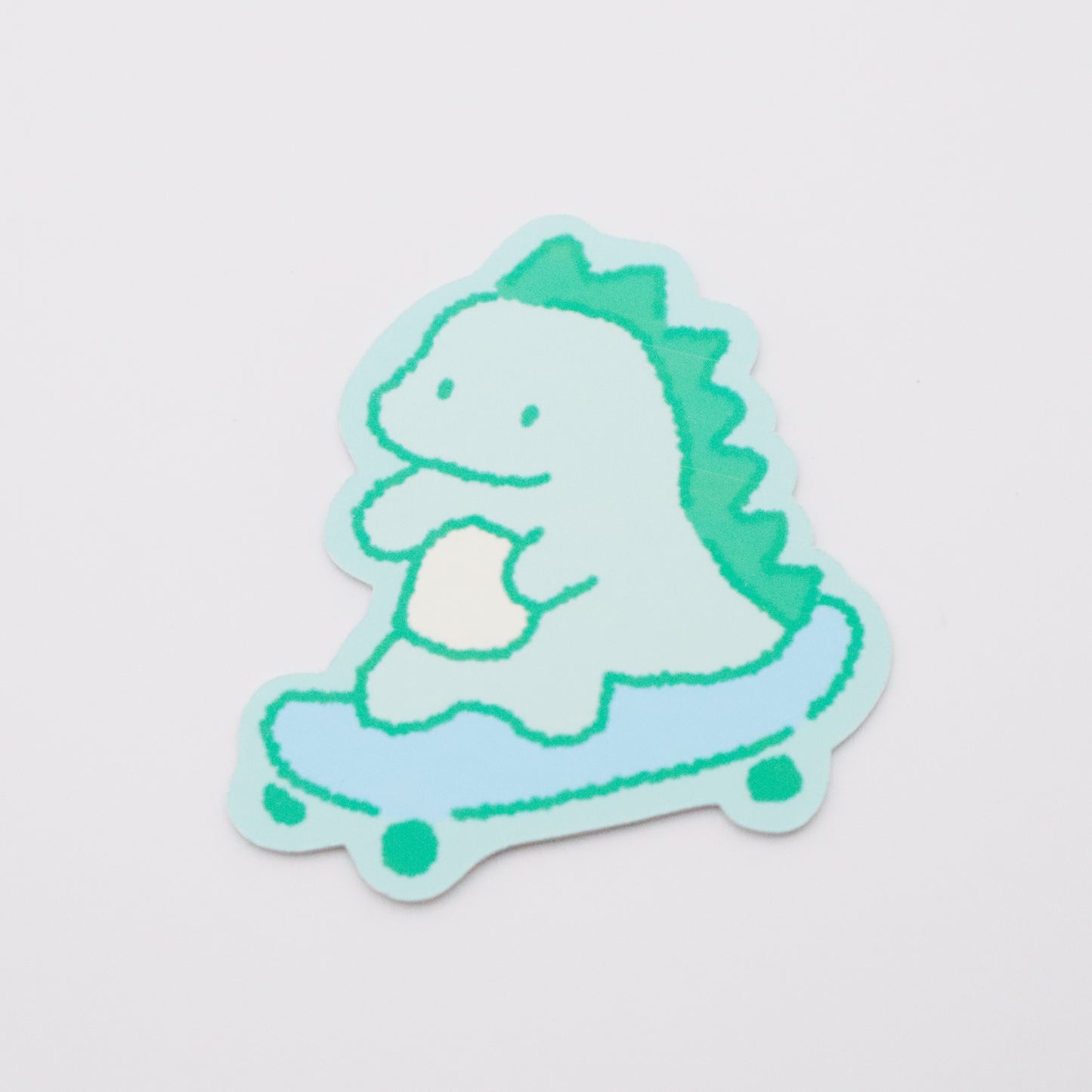 Skateboarding Dinosaur (green) | Sticker