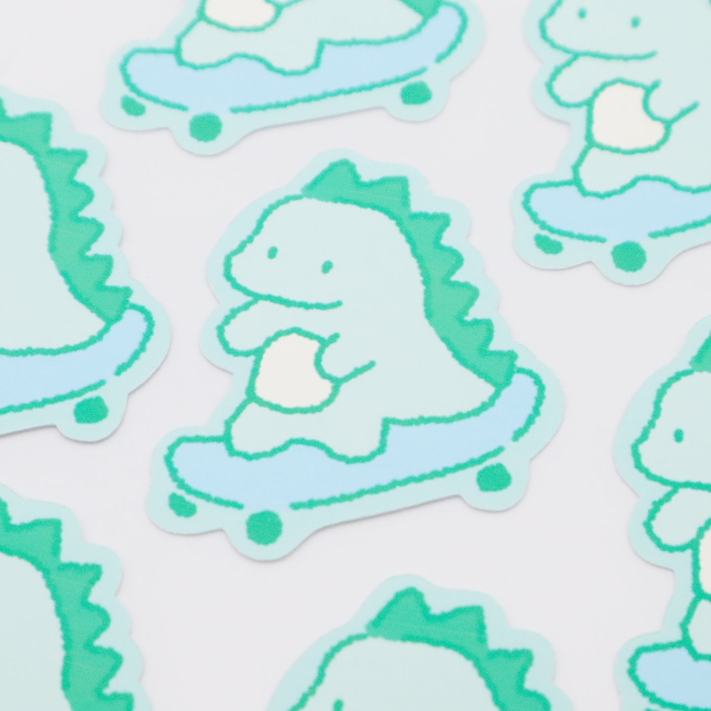 Skateboarding Dinosaur (green) | Sticker