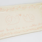 Decorative plate with snail illustrations and text on a white background