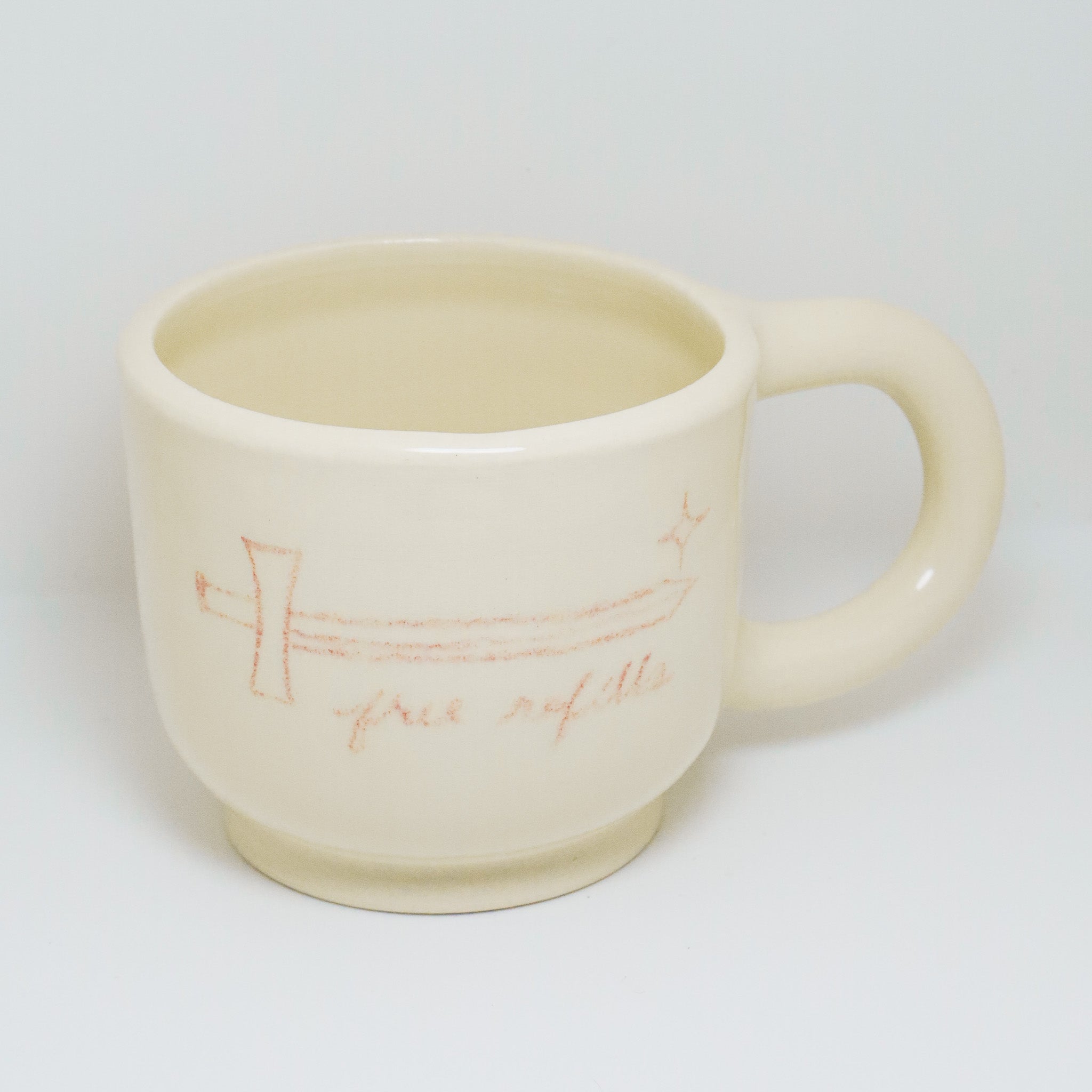 White ceramic mug with a handle on a white background