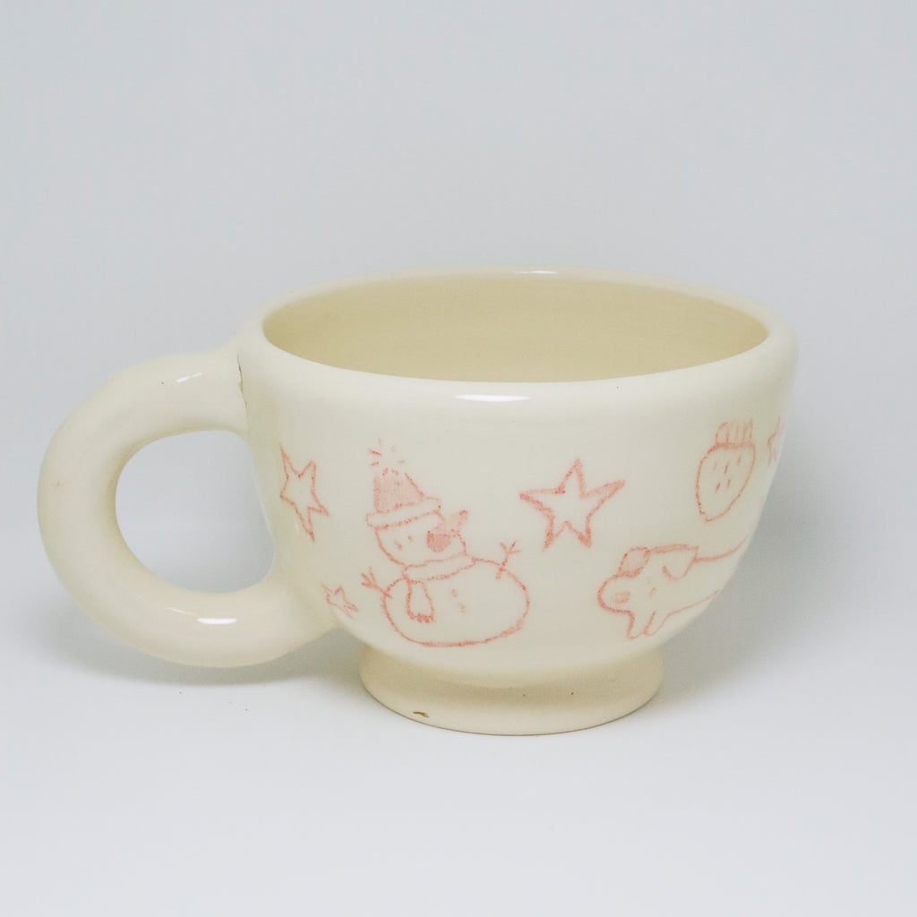 White ceramic mug with red illustrations on a white background