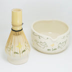 Ceramic whisk and bowl set with cat illustrations on a white background